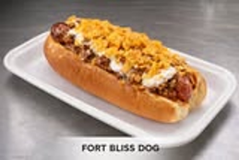 Fort Bliss Dog with chili and cheese on a tray.